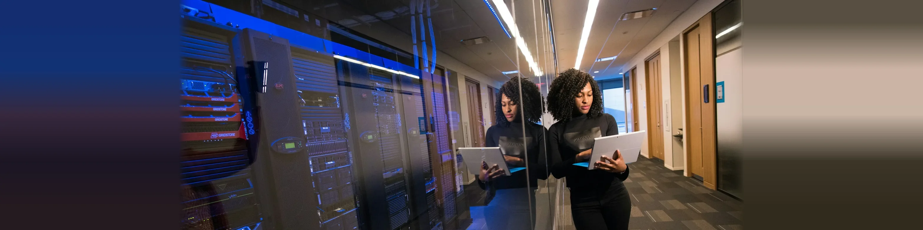 Engineers checking servers in a data centre during a modernization project